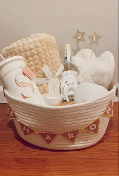 a basket filled with personal care items on top of a wooden floor