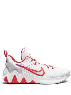 the nike zoom low is white and pink with red accents on the upper part of the shoe