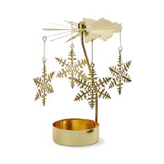 a snowflake ornament in a gold bowl