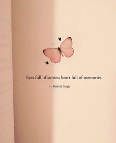 a pink butterfly flying in the air next to a wall with a quote on it