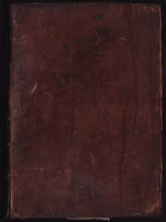 an old book with brown paper on it