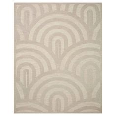 a beige rug with an abstract design on the front and back side, in shades of grey