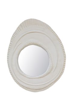 a white circular mirror on the wall with braided edges and a small round hole in the middle