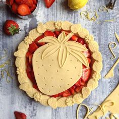 an image of a pie with fruit in the shape of a heart on it's crust