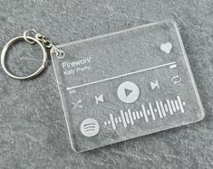 a keychain that is shaped like a music player