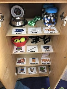 a wooden shelf filled with lots of different items