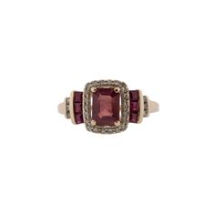 This stunning natural ruby and diamond ring is the perfect way to show your unique style. Featuring .14ctw single cut diamonds, .50ctw square step cut rubies and a .50ct center natural light flux treated ruby, this ring will make a bold statement. Crafted from 14k rose gold for a beautiful finish, this ring will be sure to stand out. The ring is currently a size 7, and can be adjusted to fit your finger for a small fee. Red Baguette Cut Diamond Accent Rings, Square Cut Ruby Jewelry Fine Jewelry, Emerald Cut Ruby Ring With Multi-stone, Emerald Cut Ruby Ring With Diamond Accent Stones, Red Emerald-cut Rings With Diamond Accents, Emerald Cut Multi-stone Ruby Jewelry, Red Emerald Cut Rings With Diamond Accents, Emerald Cut Red Rings With Diamond Accents, Square Cut Ruby Ring Fine Jewelry