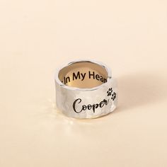 a silver ring with the words in my heart copper written on it