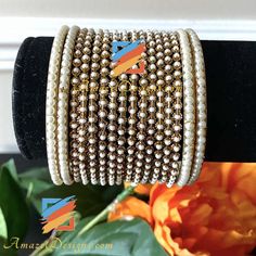 Moti Bangles Bangle Set can be customized with any Bangle or Kada. - Talk to us to Add or Remove any bangle and adjust pricing. - Price shown is for Both Hands Explore more INDIAN BANGLES, Indian Kada, CHURA, Bridal Kada 👉 PUNJABI BRIDAL JEWELLERY ONLINE 💁🏻‍♀️Kamalika, US ⭐️⭐️⭐️⭐️⭐️ Great collection. Prompt delivery. Exceeded my expectations- more beautiful than the picture. Love the packaging which comes with a 'Thank You' note. Great customer care. Very happy with whatever I purchased. High Gold Beaded Bangle For Wedding, Metal Bangle Bracelets For Celebration, Adjustable Round Cuff Bracelet For Festive Occasion, Adjustable Metal Bracelet For Celebration, Adjustable Metal Bracelets For Celebration, Hand Set Metal Bracelets For Celebration, Wedding Metal Cuff Bracelet, Adjustable Gold Beads Bracelet For Wedding, Adjustable Gold Beads Bracelets For Wedding