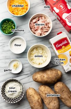 the ingredients needed to make baked potato casserole laid out on a marble counter top