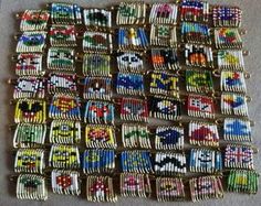 several pieces of colorful beaded bracelets sitting on top of a white cloth covered floor