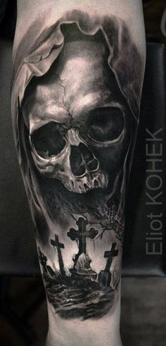 a black and white photo of a skull with a cross on it's arm