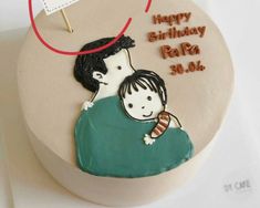 a birthday cake with an image of a man holding a child