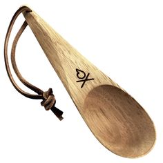 a wooden spoon with the word x on it and a cord attached to its end