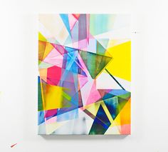 an abstract painting on a white wall with multiple colors and shapes in the background,