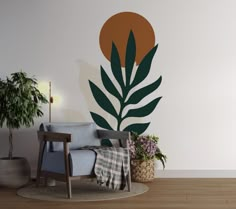 a living room with a chair, potted plant and wall decal on the wall