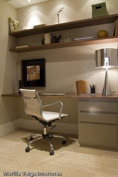 a white office chair sitting in front of a desk