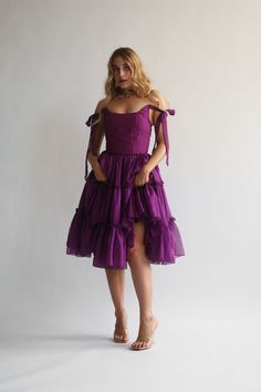 Orders ship out approx 1-3 days after purchase. Transit times approx 3-5 days for US destinations. Our signature Siena is THE main character dress. Siena features a three tier dress in the perfect shade of dark jewel-tone purple.The bust features V shaped corset boning that gives a flattering look. The Siena features a functional corset back closure that you can tighten for a snatched bodice look, adjusting the bust and the waist, helping you get the perfect fit every time. The scooped neckline Jewel Tone Outfits, Vintage Dress Aesthetic, Main Character Dress, Jewel Tone Dress, Dark Fairytale, Corset Boning, Corset Skirt, Tier Dress, Scooped Neckline