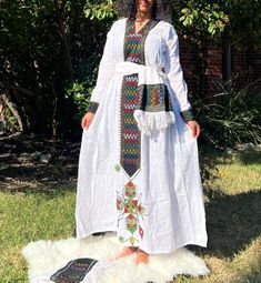 Beautiful  Lakomelza Tilf Wollo Amhara Dress with Raya (Shurab) Fabric.  Dress Type: Sindid Tilf - Gumaj (Double Til'et on the back)  Model Size: US Medium  Height: 5'6" Includes  * Two equal sized scarfs for waist & shawl * Elastic Waistband White Long Sleeve Maxi Dress With Patchwork, White Long Sleeve Patchwork Maxi Dress, White Long Sleeve Folk Maxi Dress, Back Model, Types Of Dresses, Scarfs, Shawl, White Dress, Dress Outfits