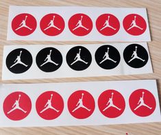 four stickers with the logos of different sports teams on them