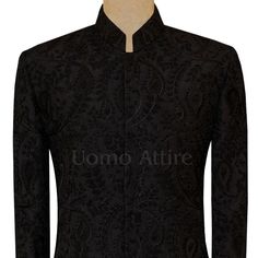 Description A beautiful sherwani is the perfect way to show off your style and personality as a groom, so this luxurious black sherwani is the perfect way to show off your personality as the groom on your special day. Made with premium quality fabric and adorned with beautiful embellishments, this sherwani is sure to turn heads. The black color is a classic choice that will never go out of style, and the embellishments add a touch of luxury and sophistication. This sherwani can be paired with a Designer Black Nehru Jacket With Traditional Drape, Designer Black Tuxedo For Groom, Designer Black Nehru Jacket For Ceremonial Occasions, Traditional Black Tuxedo For Groom, Traditional Black Groom Tuxedo, Black Tuxedo For Groom Festive Occasion, Festive Black Tuxedo For Groom, Designer Black Ceremonial Sets, Black Designer Ceremonial Sets