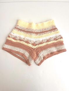 Shorts crocheted cream and pink handmade unique style boho fashion handcrafted shorts for vacation loungewear High-waisted Beige Shorts For The Beach, Beige High-waisted Shorts For The Beach, Beige High-waisted Shorts For Beach, White Crochet Beach Bottoms, White Crochet Bottoms For Beach, White Summer Shorts For Festival, White Summer Festival Shorts, Crochet Shorts For Summer Vacation, Crochet Summer Shorts For Beach Season