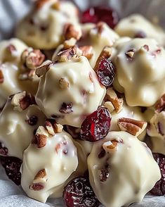 a pile of cranberry covered desserts sitting on top of a white plate