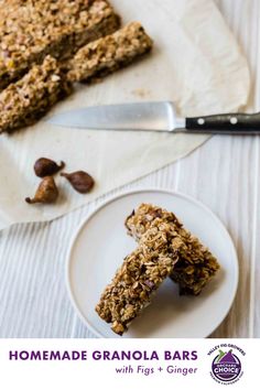 homemade granola bars with figs and ginger on a plate next to a knife