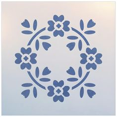 a blue stencil with flowers in a circle on a white background is shown