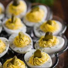 deviled eggs with mustard spread on them