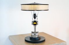 a lamp sitting on top of a wooden table