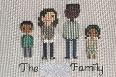 the family cross stitched together on a piece of fabric