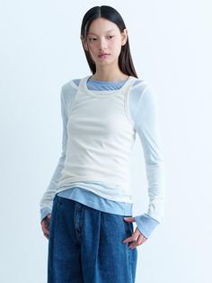 This is a modern and refined t-shirt by kuho plus that is made out of high quality and sturdy material. With distinctive mood of the design and comfortable wear, you can style it for your modern daily outfit.- Unique layered design detail- Sheer boatneck long sleeve - Sturdy ribbed sleeveless top Long Sleeve Shirt Layering Outfit, Modern White Tops For Layering, Long Sleeve With Tshirt Over Outfit, Tshirt Layering Outfit, Layered Tshirt Outfits, Layered Shirts Outfit, Tshirt Layering, Shirt Layering Outfit, Outfits Unique