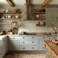 a kitchen with lots of open shelving and wooden shelves on the wall above the sink