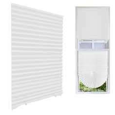 an open window with white blinds in front of it and the bottom part of the window closed