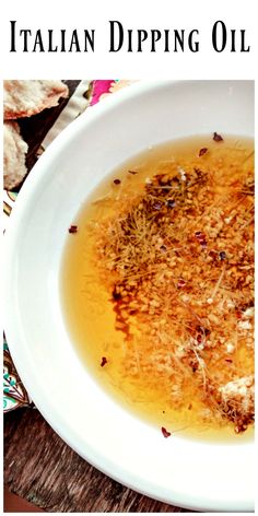 a white bowl filled with food on top of a wooden table