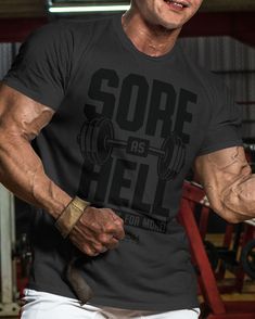 Sore As Hell Funny Motivational Workout Gym T-Shirt, Gym Gear, Gym Apparel, Workout Gift, Gift for Weightlifters, Gift for him This Sore As Hell Funny Motivational Workout T-Shirt for Men is the perfect gift for any gym lover. Made with very soft and lightweight blend of 60% cotton and 40% poly, it offers a comfortable and regular fit. With its manly fashion cut and side seams, this t-shirt combines style and comfort. Take your workout gear to the next level with this funny and comfortable gym t Workout Shirt With Letter Print And Crew Neck, Crew Neck Workout Shirt With Letter Print, Athletic Fit Crew Neck T-shirt For Gym, Short Sleeve Gym Tops With Sublimation Print, Graphic Tee Tops With Short Sleeves For Training, Graphic Tee For Training With Short Sleeves, Sweat-resistant Athletic Fit T-shirt For Workout, Graphic Tee Crew Neck Activewear For Training, Graphic Tee Activewear Crew Neck For Training