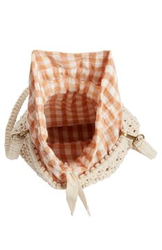 A gingham-print drawstring lining lends summery sweetness to this beach-ready bucket bag woven from chunky cotton yarns. Tie closure Removable strap Drawstring lining Textile Imported Spring Picnic Cotton Bag, Summer Cotton Bag For Picnic, Cotton Picnic Bag For Summer, Cotton Summer Picnic Bag, Casual Woven Shoulder Bag For Picnic, Spring Bucket Bag With Open Weave, Spring Vacation Cotton Straw Bag, White Cotton Bag For Picnic, Spring Beach Cotton Shoulder Bag