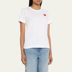 Comme des Garcons Play t-shirt with almond-eyed heart logo appliqué at left Crew neckline Short sleeves Relaxed fit Straight hem Pullover style Cotton Made in Japan Fitted Casual T-shirt With Heart Graphic, Casual Fitted T-shirt With Heart Graphic, Cotton T-shirt With Heart Patch, Short Sleeve, Cotton T-shirt With Heart Patch Short Sleeve, Cotton T-shirt With Heart Patch, Casual Cotton T-shirt With Heart Patch, Casual Summer T-shirt With Heart Patch, Cotton Graphic Tee With Heart Patch, Casual Crew Neck T-shirt With Heart Patch