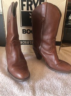 "These are vintage Frye cowgirl boots from the 1970's in excellent condition. They are dark camel in a size 8.5.  The heels are 3\" and have new heels on them. They are a pointed toe. The Frye insignia is on the side of the boot.  This is the original Leather exterior, interior, insole and outsole Exterior pull-on straps  Black top-stitching FRYE stamp and label in interior Embossed FRYE logo on sides above heels Stacked tapered wooden heels with heel caps" New Heels, Womens Cowgirl Boots, Wooden Heels, Leather Western Boots, Heel Caps, Cowboy Western, Wooden Heel, Western Cowboy Boots, Cowgirl Boots