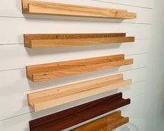 several wooden shelves mounted on the wall