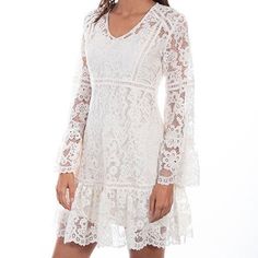 Channel your inner Stevie Nicks with this ivory lace dress with flare sleeves. The splender of this beautifully designed cotton blend lace dress can't be denied. It is a two piece dress with a separate lining. The inspiring sleeves flare out and have scalloped edges as well as the hemline. Import. Machine wash cold with like colors only. Non-chlorine bleach when needed line dry warm iron if needed. Perfect lace dress for any cowgirl. Perfect for the rodeo, trip to Nashville or a country music co Off White Scalloped Lace Dress, Spring Cream Lace Dress With Scalloped Lace, Spring Cream Lace Dress With Scalloped Edges, Feminine Cream Lace Dress With Scalloped Lace, Feminine Lace Dress With Lace Cuffs, Cream Scalloped Lace Dress For Spring, Long Sleeve Dresses With Delicate Lace For Summer, Long Sleeve Summer Dress With Delicate Lace, Feminine Cream Lace Dress For Brunch