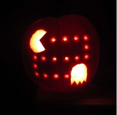 a carved pumpkin with an arrow cut out of it