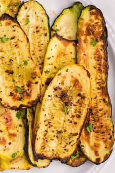 grilled eggplant and zucchini on a white plate with parsley