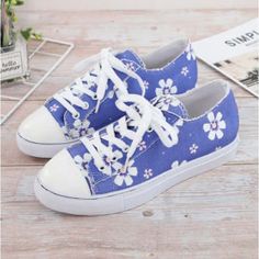 Blue With Daisies Never Worn Cute Tennis Shoes Blue Lace-up Canvas Shoes With Rubber Sole, Blue Lace-up Canvas Shoes, Casual Ankle-high Sneakers For Spring, Floral Print Canvas Shoes For Summer, Trendy Blue Lace-up Sneakers, Casual Ankle-high Canvas Shoes For Spring, Blue Sneakers With Rubber Sole, Trendy Ankle-high Canvas Shoes For Spring, Purple Lace-up Sneakers For Summer