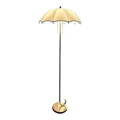 a floor lamp with an umbrella shade on it