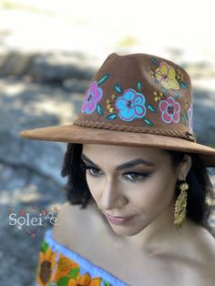 This Mexican Suede Hat has beautiful hand painted flowers, perfect to add that special touch to any outfit. This Mexican Hat is completely unique and one of a kind! Hippie Brimmed Hat For Spring, Bohemian Adjustable Sun Hat With Flower Shape, Adjustable Bohemian Sun Hat With Flower Shape, Bohemian Adjustable Flower Sun Hat, Adjustable Bohemian Flower Sun Hat, Bohemian Multicolor Fedora For Spring, Hand Painted Curved Brim Sun Hat For Spring, Hand Painted Sun Hat With Curved Brim For Spring, Spring Festival Sun Hat Hand Painted