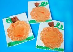 three paper plates with pictures of pumpkins on them, one painted orange and the other made brown