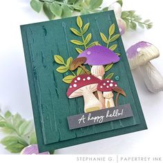 a close up of a card with mushrooms on it