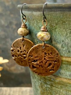 These are my handmade Copper Disc Earrings with earthy toned Czech glass beads. The copper metal discs are domed and have texture, with a very earthy tribal aesthetic, a bit Boho chic style. A great pair of everyday earrings! The ear-wires are hypoallergenic niobium wire, safer for sensitive ears. I create each piece of metal by hand, my jewelry is earthy, rustic, and organic with intentional artistic imperfections. No two pieces are exactly alike, creating truly one of a kind jewelry. ❤SIZE *7/ Bohemian Bronze Earrings With Round Beads, Bohemian Brown Round Earrings, Brown Bohemian Round Earrings, Nickel-free Brown Bohemian Earrings, Bohemian Brown Beaded Nickel-free Earrings, Vintage Brown Beaded Earrings As Gift, Vintage Brown Beaded Earrings For Gift, Bohemian Brown Beaded Round Earrings, Earthy Brown Earrings For Festivals